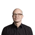 MTS Austria Man with glasses and black shirt on white background