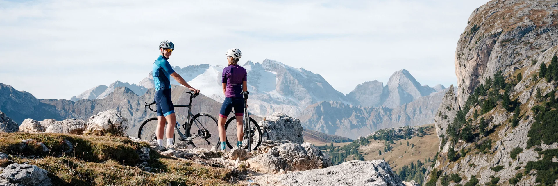 Head of Sales & Product Development © Josef Plaickner Two cyclists standing with their bikes on a mountain trail in clear weather